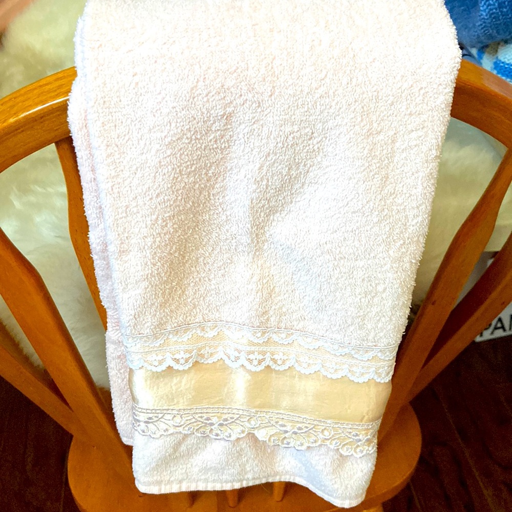Beautiful peach coloured towel with lace trim